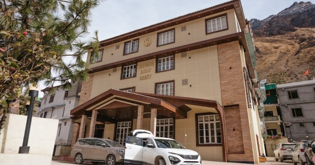 New Hotel Snowcrest Badrinath — hotel near Badrinath temple with Himalayan mountain backdrop and central heating
